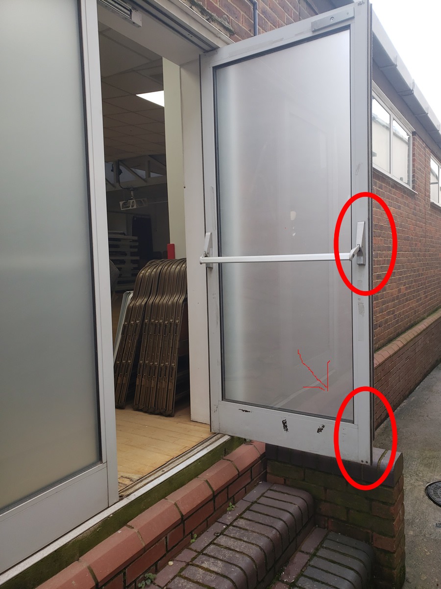 Fire escape door in a hall with fault lock